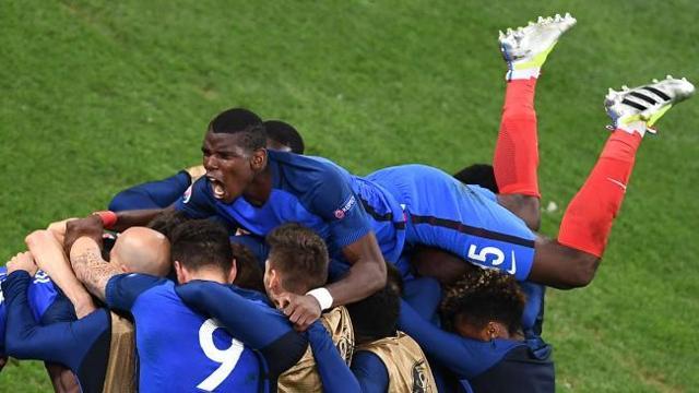 France’s midfielder Paul Pogba (top) has some shiny kicks. (AFP)