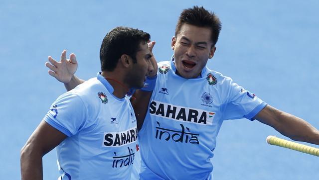 India's Raghunath Vokkaliga, left, celebrates scoring the first goal during the Pool game between Germany and India. (AP Photo) India's Raghunath Vokkaliga, left, celebrates scoring the first goal during the Pool game between Germany and India. (AP Photo)