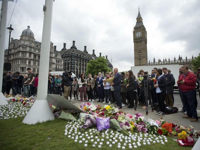 Flowers and photographs lie placed on the houseboat on the River Thames where murdered Member of Parliament Jo Cox and her family lived when they were in London. (AP) Flowers and photographs lie placed on the houseboat on the River Thames where murdered Member of Parliament Jo Cox and her family lived when they were in London. (AP)