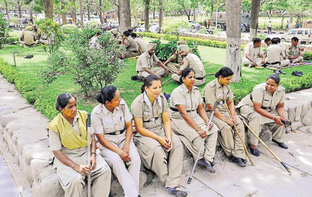 Police personnel resting after a briefing session on Friday. (Karun sharma/HT Photo) Police personnel resting after a briefing session on Friday. (Karun sharma/HT Photo)