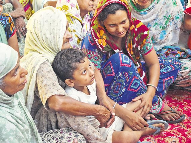 Mourning relatives of Gurdev Singh at Burj Jawahar Singh Wala village in Faridkot on Friday. (HT Photo) Mourning relatives of Gurdev Singh at Burj Jawahar Singh Wala village in Faridkot on Friday. (HT Photo)