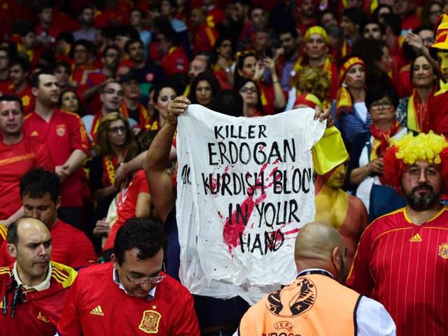 A man carries a banner during the Euro 2016 group D football match. (AFP photo) A man carries a banner during the Euro 2016 group D football match. (AFP photo)