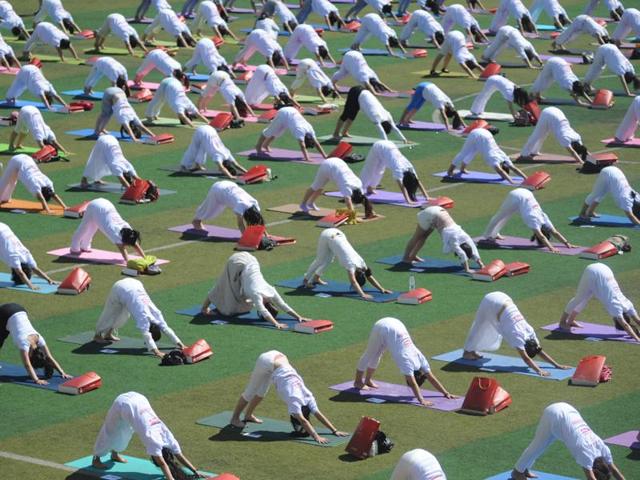 Indian women practice Yoga at a community park in a residential area as they prepare to participate in the International Yoga Day event in New Delhi. (AP) Indian women practice Yoga at a community park in a residential area as they prepare to participate in the International Yoga Day event in New Delhi. (AP)