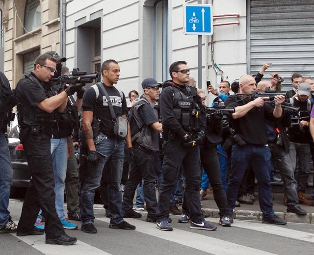 French Police aim their flash-ball guns to disperse English fans in downtown Lille, northern France. (AP Photo) French Police aim their flash-ball guns to disperse English fans in downtown Lille, northern France. (AP Photo)