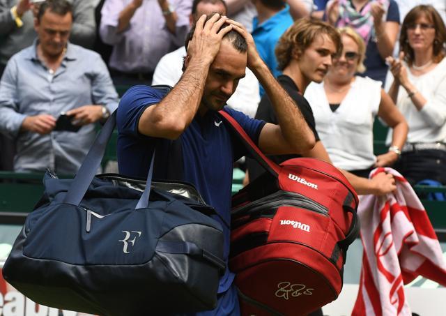Federer walks off the court after his loss. (AFP) Federer walks off the court after his loss. (AFP)