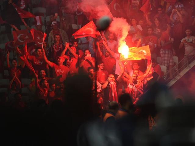 Turkey supporters carry a flare following their teams defeat during the Euro 2016 group D match. (AFP photo) Turkey supporters carry a flare following their teams defeat during the Euro 2016 group D match. (AFP photo)