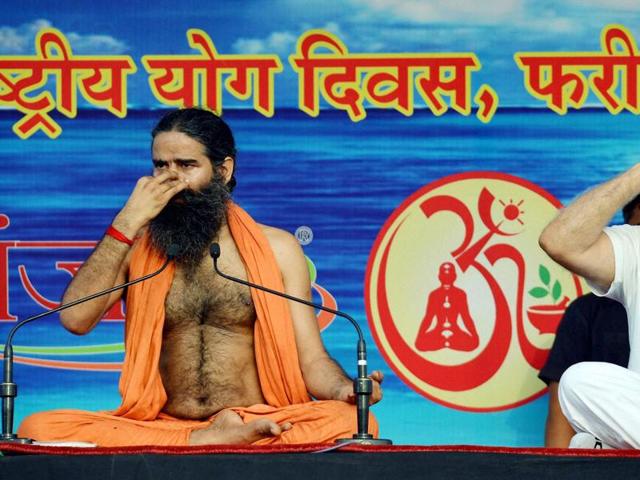 Haryana CM Manohar Lal Khattar with yoga guru Baba Ramdev during Yoga camp in Faridabad . (PTI) 