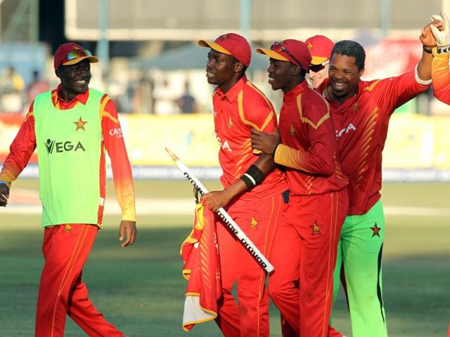 Zimbabwean players and their coach, Makhaya Ntini, second right, celebrate their win. (AP) Zimbabwean players and their coach, Makhaya Ntini, second right, celebrate their win. (AP)