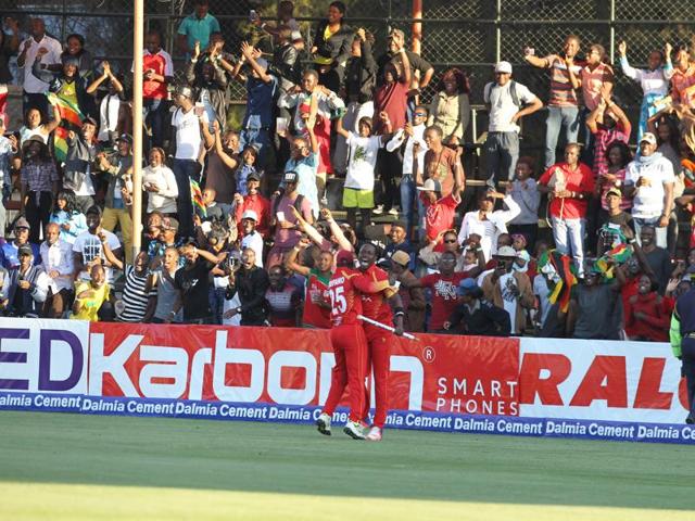 Zimbabwean players and supporters celebrate the win. (AP) Zimbabwean players and supporters celebrate the win. (AP)