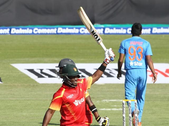 Elton Chigumbura raises his bat after completing his half-century. (AP) Elton Chigumbura raises his bat after completing his half-century. (AP)