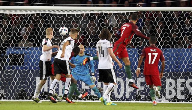 Paris : Portugal's Cristiano Ronaldo, second from right, heads the ball ago score a goal that was later disallowed, during the Euro 2016 Group F soccer match between Portugal and Austria at the Parc des Princes stadium in Paris, France, Saturday, June 18, 2016. AP/PTI(AP6_19_2016_000014A) (AP) Paris : Portugal's Cristiano Ronaldo, second from right, heads the ball ago score a goal that was later disallowed, during the Euro 2016 Group F soccer match between Portugal and Austria at the Parc des Princes stadium in Paris, France, Saturday, June 18, 2016. AP/PTI(AP6_19_2016_000014A) (AP)