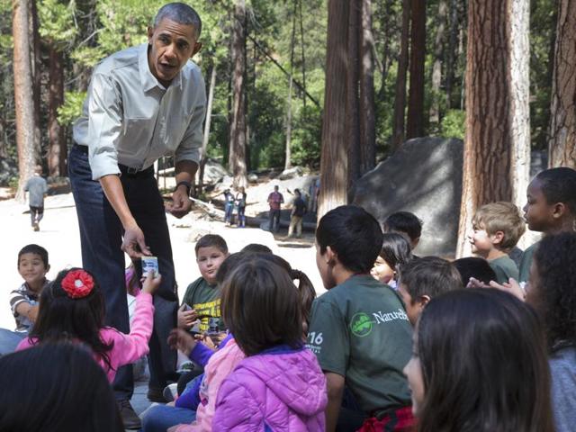 Obama hands out tickets for entry to National Parks to children attending the "Every Kid in a Park" event at Yosemite National Park. (AP) Obama hands out tickets for entry to National Parks to children attending the "Every Kid in a Park" event at Yosemite National Park. (AP)