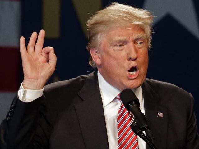An anti-Trump protester chants at an intersection a block away from the Arizona Veterans Memorial Coliseum in Phoenix, Ariz., where Donald Trump spoke on Saturday, June 18, 2016. (AP) An anti-Trump protester chants at an intersection a block away from the Arizona Veterans Memorial Coliseum in Phoenix, Ariz., where Donald Trump spoke on Saturday, June 18, 2016. (AP)