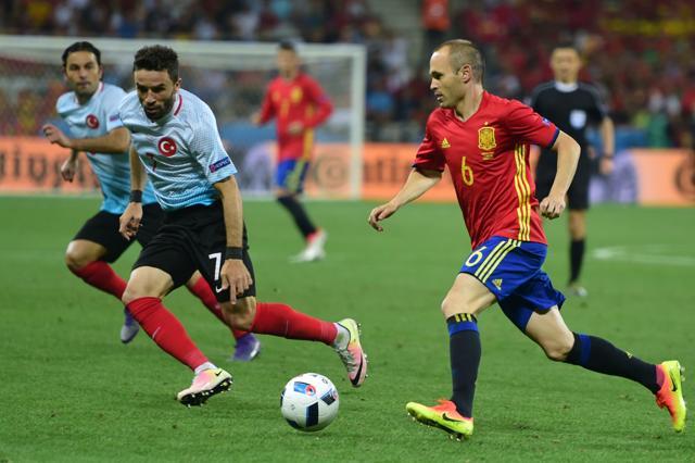 Spain's midfielder Andres Iniesta (right) runs with the ball past Turkey's defender Gokhan Gonul during the Euro 2016 group D football match between Spain and Turkey at the Allianz Riviera stadium in Nice. (AFP Photo) Spain's midfielder Andres Iniesta (right) runs with the ball past Turkey's defender Gokhan Gonul during the Euro 2016 group D football match between Spain and Turkey at the Allianz Riviera stadium in Nice. (AFP Photo)