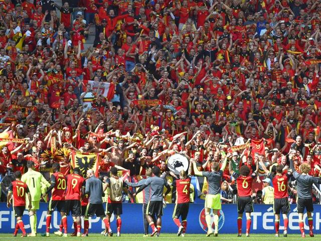 Belgium's players acknowledge their supporters at the end of the match. (AFP)