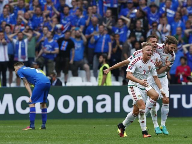 Hungary's Balazs Dzsudzsak, Adam Szalai and Tamas Kadar celebrate their 1-1 draw at the end of their Group F match against Iceland at the Stade Vélodrome in Marseille on June 18, 2016. (REUTERS)