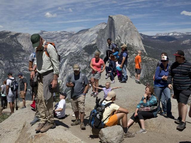 People wait for the trailhead at Glacier Point to re-open after the Obama family headed down a trail for a hike. (AP) People wait for the trailhead at Glacier Point to re-open after the Obama family headed down a trail for a hike. (AP)