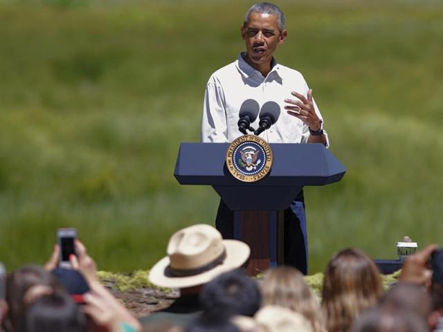 Obama speaks during a press conference in Cook's Meadow with Yosemite Falls . (AP) Obama speaks during a press conference in Cook's Meadow with Yosemite Falls . (AP)