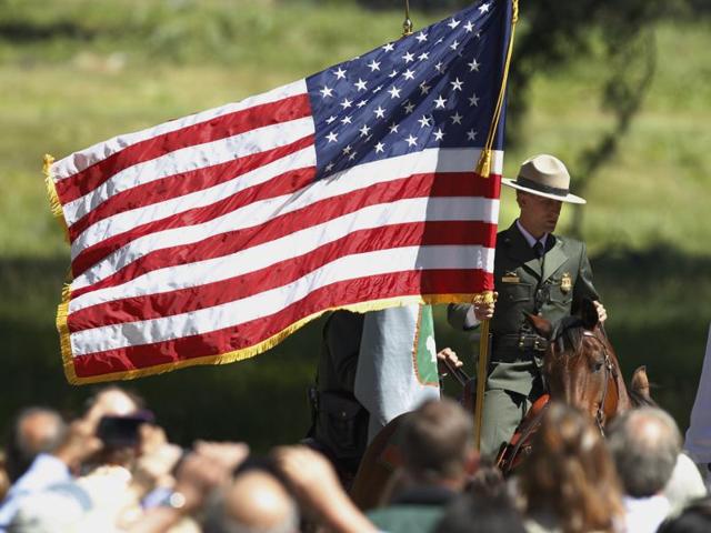 Yosemite's mounted patrol awaits the arrival of Obama for a press conference in Cook's Meadow with Yosemite Falls in the background at the park. (AP) Yosemite's mounted patrol awaits the arrival of Obama for a press conference in Cook's Meadow with Yosemite Falls in the background at the park. (AP)