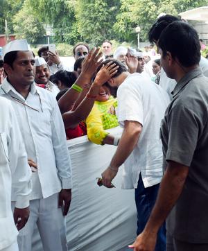 Congress vice-president Rahul Gandhi greeted by party workers at all India congress committee office in New Delhi on Sunday. (PTI)