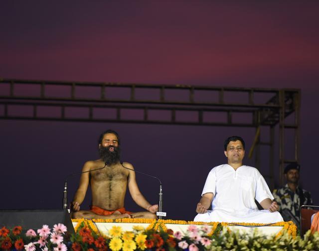 Ramdev and Acharya Balkrishna perform Yoga during the rehearsals for the upcoming International Yoga Day at Rajpath. (Sonu Mehta/HT Photo) Ramdev and Acharya Balkrishna perform Yoga during the rehearsals for the upcoming International Yoga Day at Rajpath. (Sonu Mehta/HT Photo)