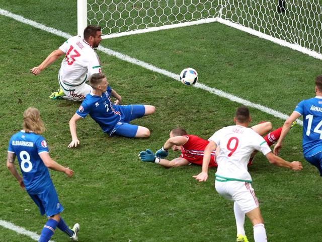 Iceland's Birkir Saevarsson, 3rd left, scores the own goal that allowed Hungary to equalise. (AP)