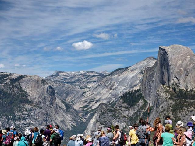 People wait near Glacier Point as Obama and his family hike to celebrate the 100th year of US national park system. Also along for the ride: National Geographic, working with Facebook to shoot an Oculus virtual reality video and taping an interview with Obama to be aired in August. (AFP) People wait near Glacier Point as Obama and his family hike to celebrate the 100th year of US national park system. Also along for the ride: National Geographic, working with Facebook to shoot an Oculus virtual reality video and taping an interview with Obama to be aired in August. (AFP)