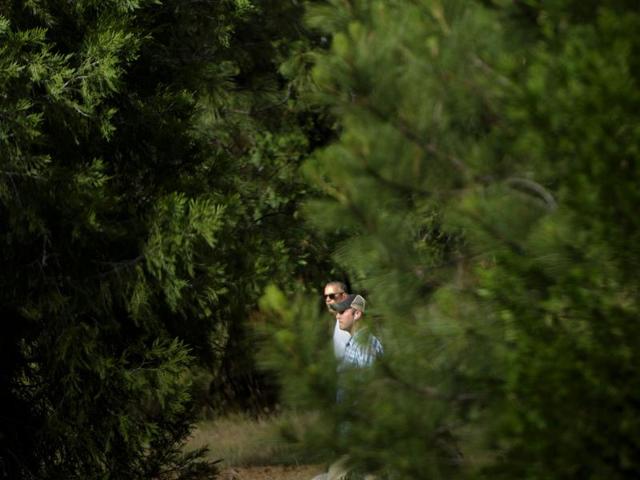 Obama (L) is seen as he hikes with the First Family. He brought his family late on Friday to Yosemite, one of the nation’s most popular national parks, on a working vacation. The trip was aimed at celebrating the centennial of the National Park Service, making the case for curbing climate change and encouraging more investment in conservation. (AFP) Obama (L) is seen as he hikes with the First Family. He brought his family late on Friday to Yosemite, one of the nation’s most popular national parks, on a working vacation. The trip was aimed at celebrating the centennial of the National Park Service, making the case for curbing climate change and encouraging more investment in conservation. (AFP)