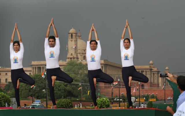 People perform yoga at Rajpath as part of International Yoga Day celebrations in New Delhi on June 21, 2015. (Arvind Yadav/ HT Photo) People perform yoga at Rajpath as part of International Yoga Day celebrations in New Delhi on June 21, 2015. (Arvind Yadav/ HT Photo)