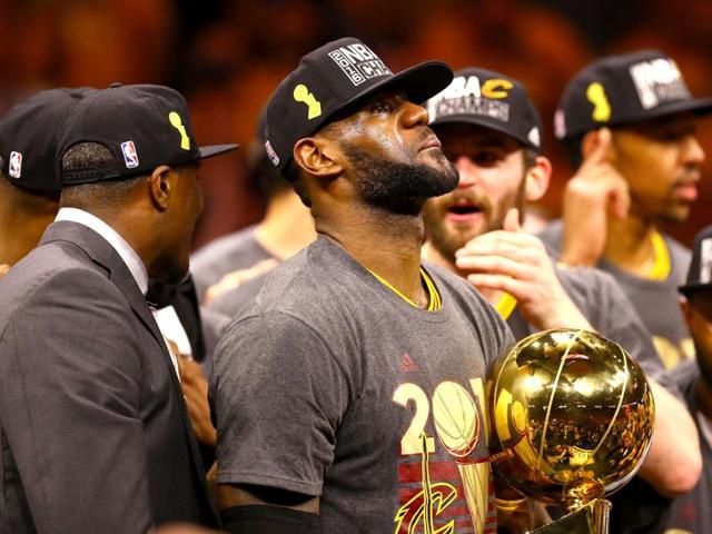 An emotional LeBron James with the trophy. (AFP) An emotional LeBron James with the trophy. (AFP)