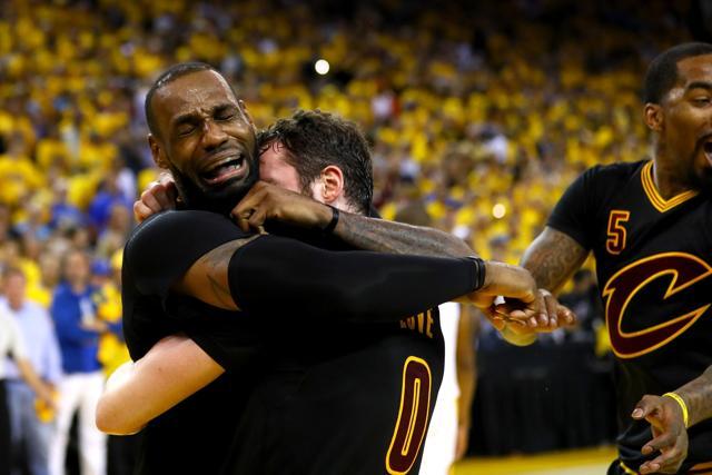 LeBron James #23 and Kevin Love #0 celebrate after the win. (AFP) LeBron James #23 and Kevin Love #0 celebrate after the win. (AFP)
