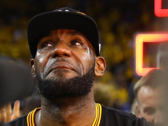 LeBron is overcome with emotion after the win. (AFP) LeBron is overcome with emotion after the win. (AFP)