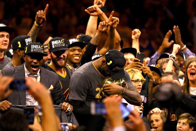 LeBron James #23 of the Cleveland Cavaliers holds the Larry O'Brien Championship Trophy (AFP) LeBron James #23 of the Cleveland Cavaliers holds the Larry O'Brien Championship Trophy (AFP)