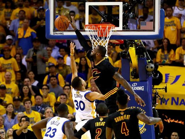 LeBron James blocks a shot by Stephen Curry. (AFP) LeBron James blocks a shot by Stephen Curry. (AFP)