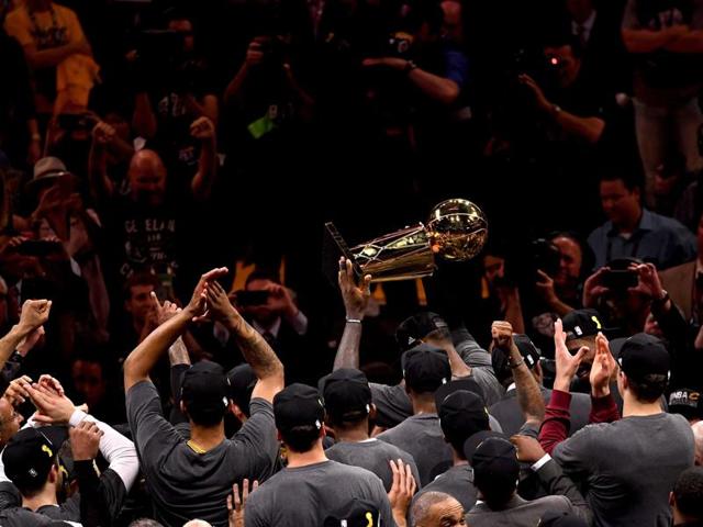 LeBron James holds up the Larry O'Brien Championship Trophy. (AFP) LeBron James holds up the Larry O'Brien Championship Trophy. (AFP)