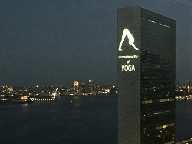 The image projected onto the UN building shows a woman doing the ‘Parvatasana’ or the ‘inverted V’ posture.