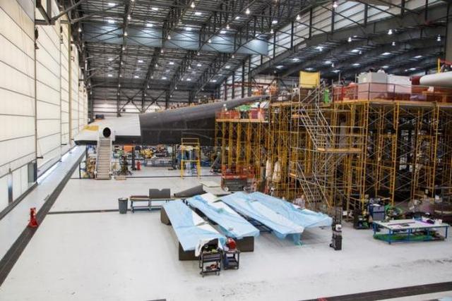 Vulcan Aerospace’s Stratolaunch rockets’ left fuselage assembly is shown under construction by Northrop Grumann Scaled Composites at the Mojave Air and Space Port in Mojave, California, U.S. in this handout photo released to Reuters June 19, 2016. Vulcan Aerospace’s Stratolaunch rockets’ left fuselage assembly is shown under construction by Northrop Grumann Scaled Composites at the Mojave Air and Space Port in Mojave, California, U.S. in this handout photo released to Reuters June 19, 2016.