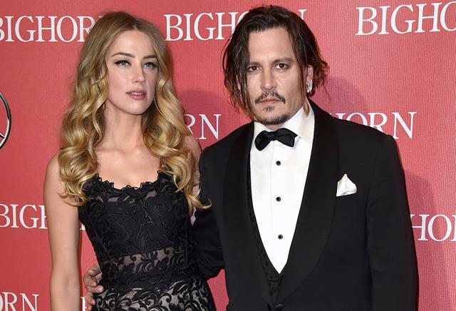 File picture of Johnny Depp and Amber Heard. Court records show Heard filed for divorce in Los Angeles superior court on May 23, 2016, citing irreconcilable differences. The pair were married in February 2015 and have no children together. (Jordan Strauss/Invision/AP) File picture of Johnny Depp and Amber Heard. Court records show Heard filed for divorce in Los Angeles superior court on May 23, 2016, citing irreconcilable differences. The pair were married in February 2015 and have no children together. (Jordan Strauss/Invision/AP)