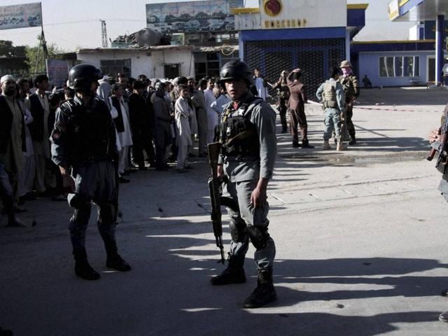Afghan police personnel inspect the site of a suicide attack in Kabul on Monday. (AP) Afghan police personnel inspect the site of a suicide attack in Kabul on Monday. (AP)