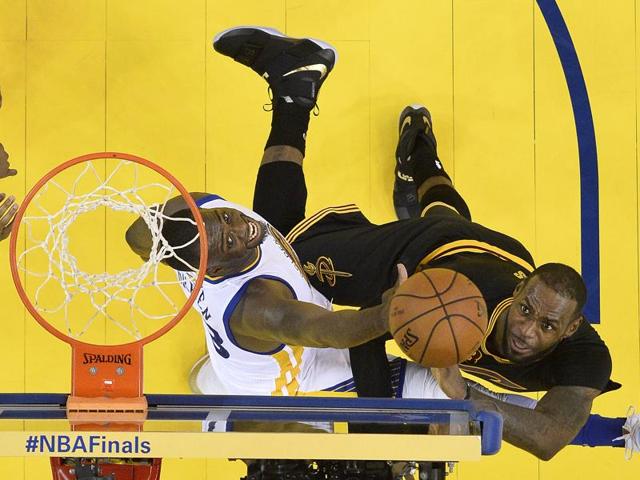 LeBron James, right, shoots against Golden State forward Draymond Green. (AP) LeBron James, right, shoots against Golden State forward Draymond Green. (AP)