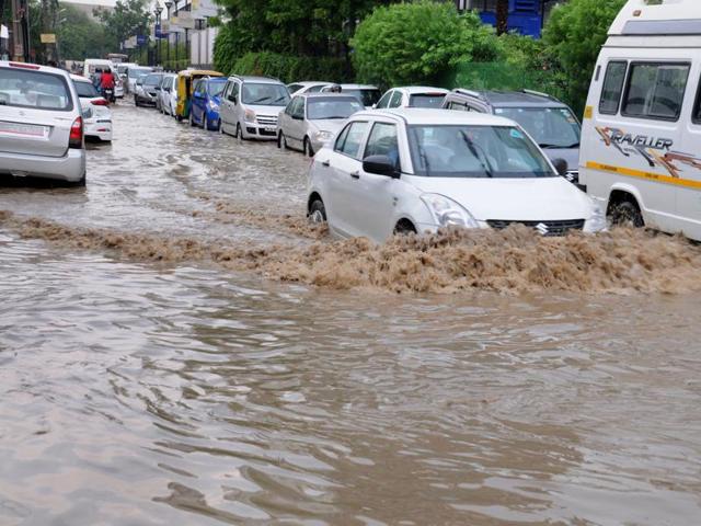 Residents said most areas were under water after the drains that are clogged with silt and garbage failed to carry rainwater.(Parveen Kumar/HT Photo) Residents said most areas were under water after the drains that are clogged with silt and garbage failed to carry rainwater.(Parveen Kumar/HT Photo)