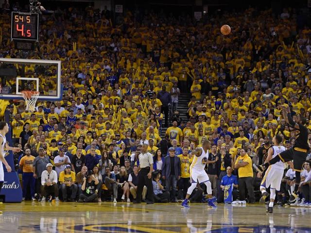 Cleveland Cavaliers guard Kyrie Irving, right, shoots a 3-pointer against Golden State guard Stephen Curry. (AP) Cleveland Cavaliers guard Kyrie Irving, right, shoots a 3-pointer against Golden State guard Stephen Curry. (AP)