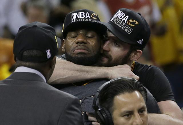An emotional LeBron James, left, is hugged by Kevin Love after the Cleveland Cavaliers won the NBA Finals. (AP) An emotional LeBron James, left, is hugged by Kevin Love after the Cleveland Cavaliers won the NBA Finals. (AP)