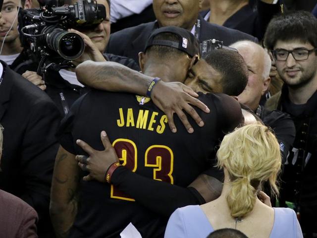 LeBron James (23) hugs teammate Kyrie Irving after the win. (AP) LeBron James (23) hugs teammate Kyrie Irving after the win. (AP)
