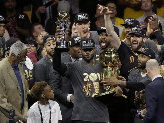 LeBron James, center, celebrates with teammates after the win. (AP) LeBron James, center, celebrates with teammates after the win. (AP)