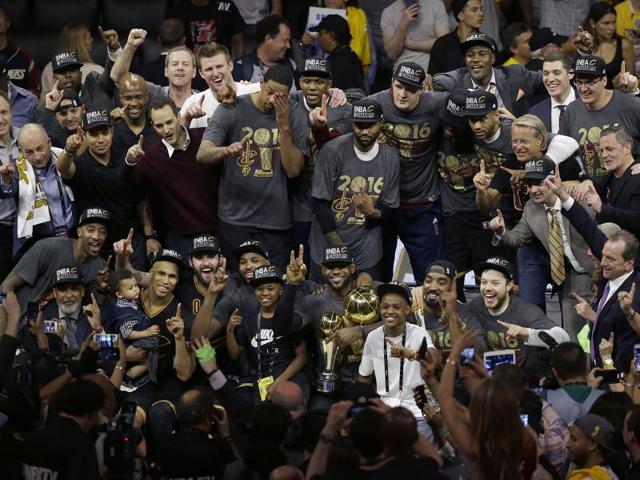 The Cavs pose for a photo with teammates, family and staff. (AP) The Cavs pose for a photo with teammates, family and staff. (AP)