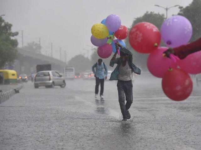 Hot, simmering Delhi let out a collective sigh of relief today afternoon as it welcomed a deluge of rain. (Ravi Choudhary/ HT Photo) Hot, simmering Delhi let out a collective sigh of relief today afternoon as it welcomed a deluge of rain. (Ravi Choudhary/ HT Photo)