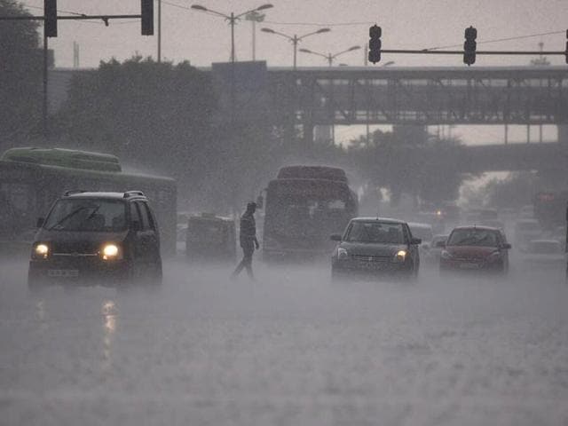 By mid-afternoon, Delhi was greeted by torrential rain, flooding the roads. At the Dhaula Kuan crossing, commuters were caught unawares in the pouring rain. (Ravi Choudhary/ HT Photo) By mid-afternoon, Delhi was greeted by torrential rain, flooding the roads. At the Dhaula Kuan crossing, commuters were caught unawares in the pouring rain. (Ravi Choudhary/ HT Photo)