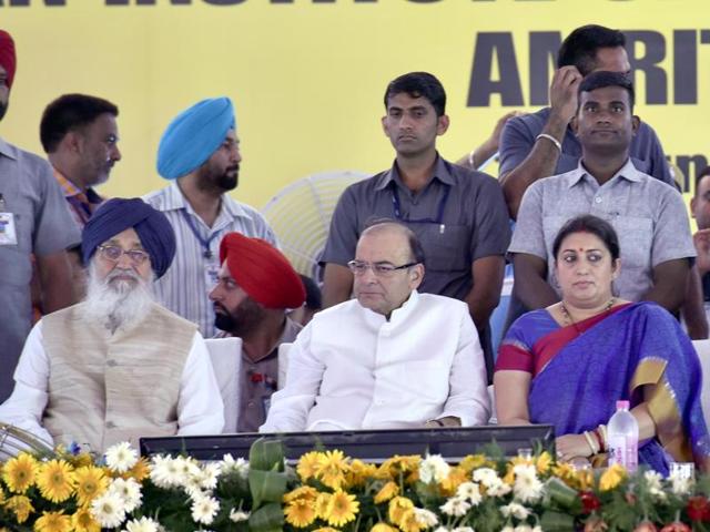 (L-R) Chief minister Parkash Singh Badal, Union finance minister Arun Jaitley and HRD minister Smriti Irani during the stone-laying ceremony of the IIM in Manawala near Amritsar on Sunday.(Gurpreet Singh/HT Photo) (L-R) Chief minister Parkash Singh Badal, Union finance minister Arun Jaitley and HRD minister Smriti Irani during the stone-laying ceremony of the IIM in Manawala near Amritsar on Sunday.(Gurpreet Singh/HT Photo)