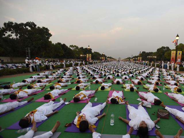 Participants perform yoga during a rehearsal for the upcoming International Yoga Day event at Rajpath. (sonu mehta/Ht photo) Participants perform yoga during a rehearsal for the upcoming International Yoga Day event at Rajpath. (sonu mehta/Ht photo)